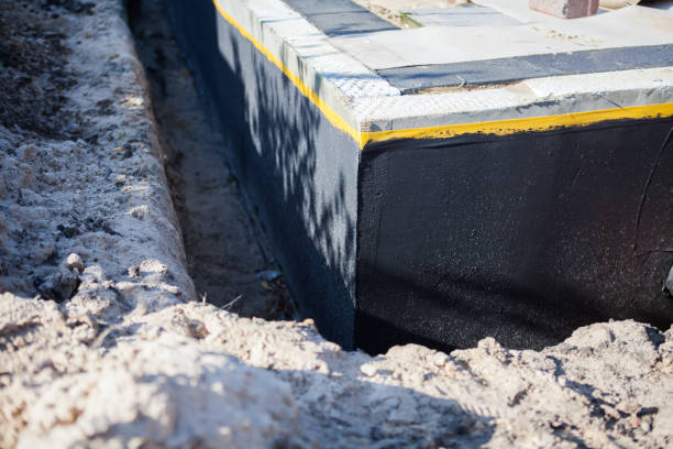 Professional Emergency Waterproofing technician working in Marquette, WI